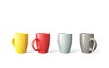 Colored cups on white background