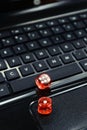 Colored dices on keyboard - on line gambling concept