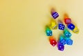 colored dices showing different numbers on colored background. Free copy space. Concept of game, winning combination. Colored