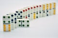 Colored dominoes lined up, domino effect