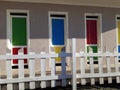 Colored doors of the beach huts. Summer is far away and they are closed.