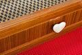 Colored drawer wooden furniture with heart shaped knob.