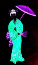 A young oriental woman with green komono, fan and purple umbrella