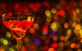 Colored drink in glass, cocktail, night lights bokeh background