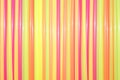 Colored drinking straws. Vertically folded. Bright background of tubes