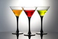 Coloured drinks in martini glasses, cocktails with liqueurs Royalty Free Stock Photo