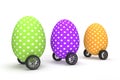 3 colored easter eggs with dots on wheels as cars