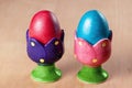 Colored easter eggs in egg cups Royalty Free Stock Photo