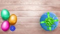 Colored Easter eggs and gift box on wooden planks Royalty Free Stock Photo