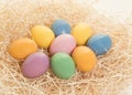 Colored easter eggs lying in a nest on a white background Royalty Free Stock Photo