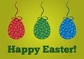 Colored Easter eggs with a pattern hung on a rope with a bow. Royalty Free Stock Photo