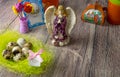 Colored Easter eggs table decoration with angel Royalty Free Stock Photo