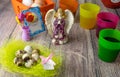 Colored Easter eggs table decoration with angel Royalty Free Stock Photo