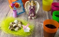 Colored Easter eggs table decoration with angel Royalty Free Stock Photo