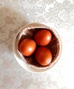 Colored eggs in the nest for Easter. According to legend, every member of the family must eat egg so that family buys house