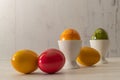 colored eggs on table or in egg cup Royalty Free Stock Photo