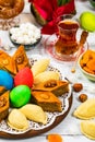 Colored eggs, wheat springs and sweet pastry for Novruz Holiday in Azerbaijan Royalty Free Stock Photo