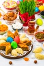 Colored eggs, wheat springs and sweet pastry for Novruz Holiday in Azerbaijan Royalty Free Stock Photo