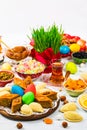 Colored eggs, wheat springs and sweet pastry for Nowruz Holiday in Azerbaijan Royalty Free Stock Photo