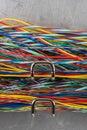 Colored electric cable on hooks of organizer Royalty Free Stock Photo