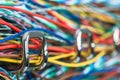 Colored electric cable on hooks of organizer Royalty Free Stock Photo