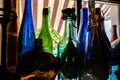 Colored empty bottles are on the windowsill Royalty Free Stock Photo