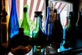 Colored empty bottles are on the windowsill Royalty Free Stock Photo