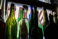 Colored empty bottles are on the windowsill Royalty Free Stock Photo