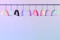 Colored empty hangers in the wardrobe Royalty Free Stock Photo