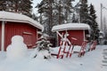 Akeslompolo typical sledges in front of red cabins