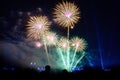 Colored firework background with free space for text. Colorful fireworks at night light up the sky with dazzling display