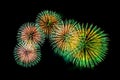 Colored fireworks display on dark sky background. Royalty Free Stock Photo