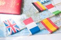 Colored flags of Europian countries on a map: France, Italy, England UK, Spain, Greece, travel destination planning concept Royalty Free Stock Photo