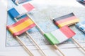 Colored flags of Europian countries on a map: France, Italy, England UK, Spain, Greece, travel destination planning concept Royalty Free Stock Photo