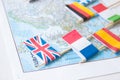 Colored flags of Europian countries on a map: France, Italy, England UK, Spain, Greece, travel destination planning concept Royalty Free Stock Photo