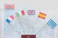 Colored flags on the map of Europe: France, Italy, England UK, Spain, Greece, travel plan. Travelling by car concept