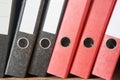 Colored folders for office files and paper on a shelf. Background image Royalty Free Stock Photo