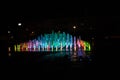 A colored fountain with illumination at night. A fabulous fountain. Background.