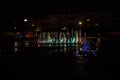 A colored fountain with illumination at night. A fabulous fountain. Background.