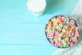 Colored fruit grain loops with a glass of milk on the table. breakfast concept Royalty Free Stock Photo