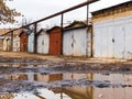 Colored garages near the ruined road