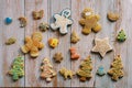 Colored ginger glazed cookies lie on a wooden table