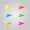 Colored glass arrows on a gray background .