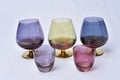 colored glass goblet with cognac and cheese