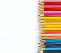 Colored ground pencils on white background, rod close-up, pink, yellow, blue Royalty Free Stock Photo