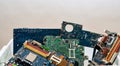 Colored heap of electronic, plastic and metal parts from old discarded or obsolete PC components. Ecological danger