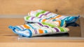Colored heat-resistant gloves placed on an induction hobs