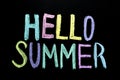 Colored hello summer on blackboard