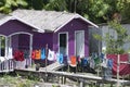 Lilac painted house with laundry in front Royalty Free Stock Photo