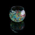 Colored hydrogel balls in a glass vase on a black background Royalty Free Stock Photo